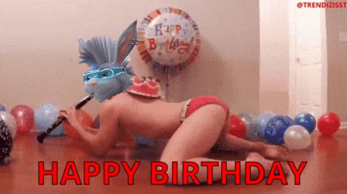 a man playing a clarinet in front of a birthday balloon