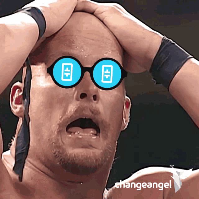 a man wearing a pair of glasses with a blue circle in the middle of them