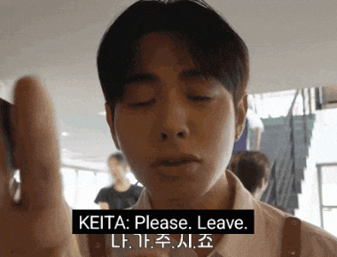 a man with his eyes closed says keita please leave in a foreign language