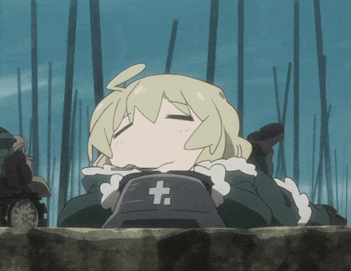 a girl with a cross on her hat is laying on the ground