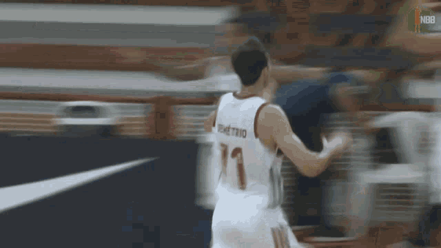 a basketball player wearing a number 11 jersey