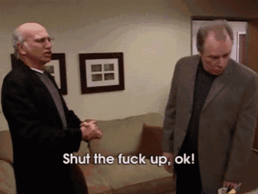 two men standing next to each other with the words shut the fuck up ok on the bottom right