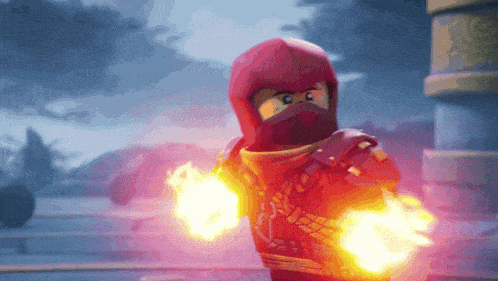 a lego ninjago character is holding a pair of flames in his hands .