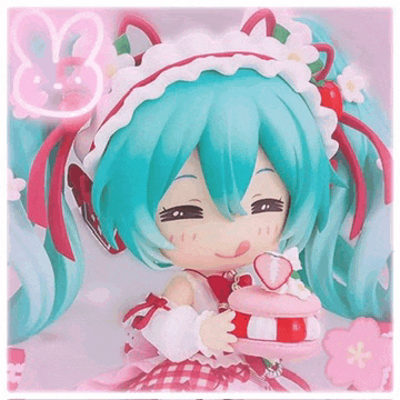 a figurine of a girl with blue hair holding a pink cake