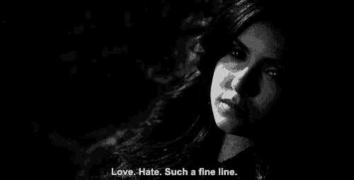 a black and white photo of a woman with the words `` love , hate . such a fine line '' .