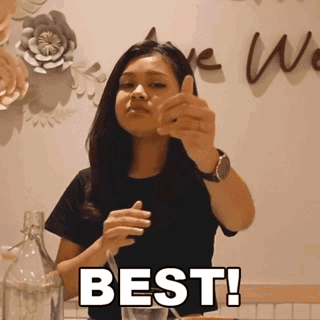 a woman is giving a thumbs up and the word best is on the bottom