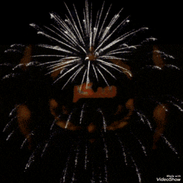 a fireworks display with the words happy birthday in the foreground