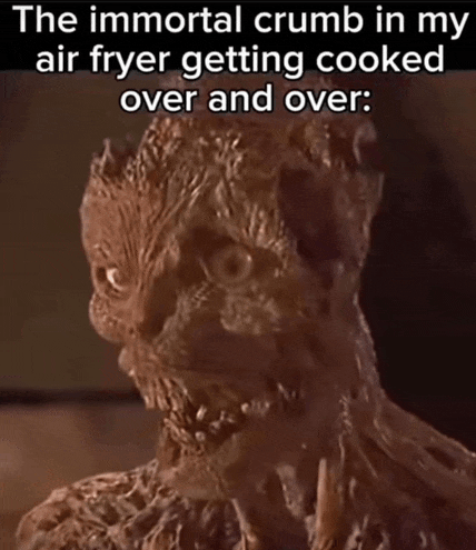a picture of a monster with the caption " the immortal crumb in my air fryer getting cooked over and over "