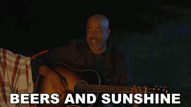 a man playing a guitar with the words " beers and sunshine " below him