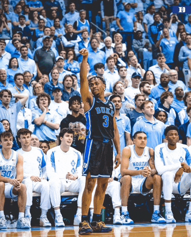 a duke basketball player stands in front of a crowd