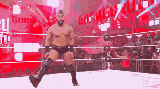 a man in a wrestling ring with the word chicago on the wall