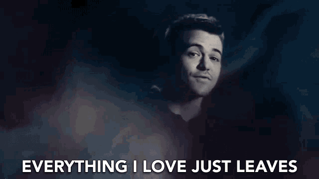 a man is singing into a microphone and the words `` everything i love just leaves '' are written above him .