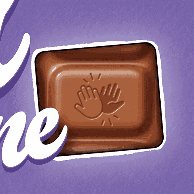 a close up of a milka bar with two hands on it