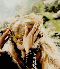 a woman is wearing a crown on her head