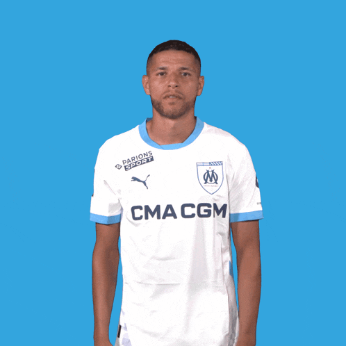 a man wearing a white shirt that says cmacgm