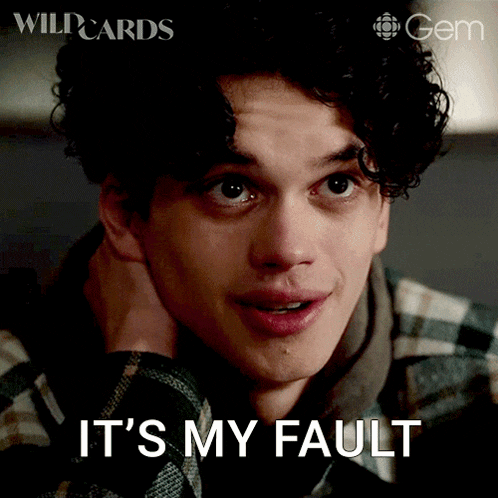 a young man with curly hair has the words it 's my fault written on his face
