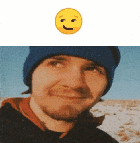 a man with a beard wearing a blue hat and a smiley face behind him