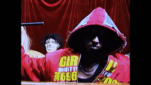 a man wearing a red hoodie that says gir on it