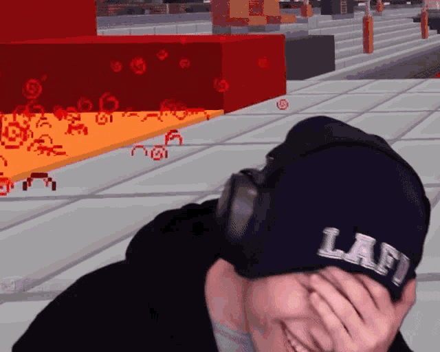 a man wearing headphones and a hat with the word laf on it