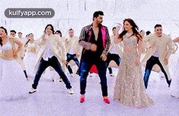 a group of people are dancing together in a dance studio .