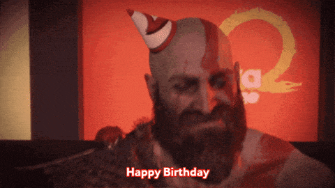 a man with a beard wearing a party hat says " happy birthday "