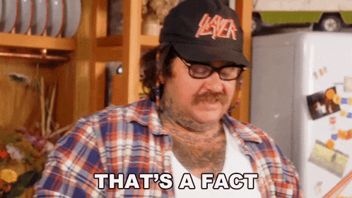 a man wearing a slayer hat and glasses is saying that 's a fact