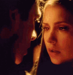 a man and a woman are looking at each other