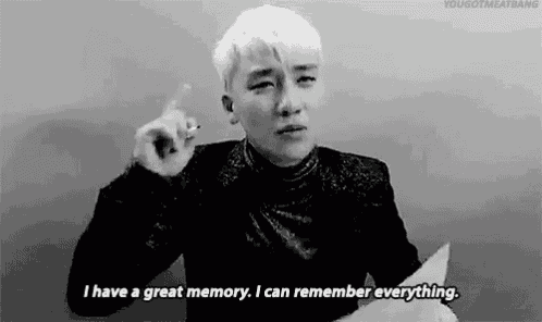 a black and white photo of a man talking and saying `` i have a great memory , i can remember everything . ''