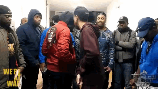 a group of men are standing in a room with the words " we do a way " on the bottom right