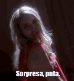 a woman in a red dress with the words sorpresa puta written below her