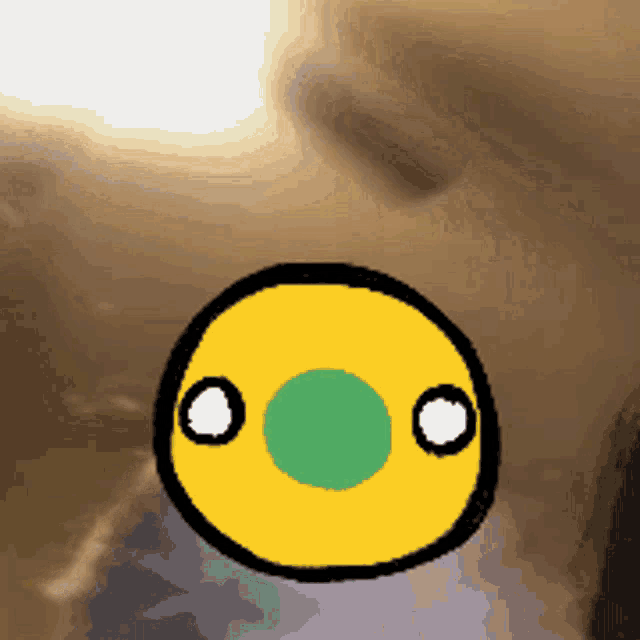 a cartoon drawing of a yellow circle with a green circle in the middle