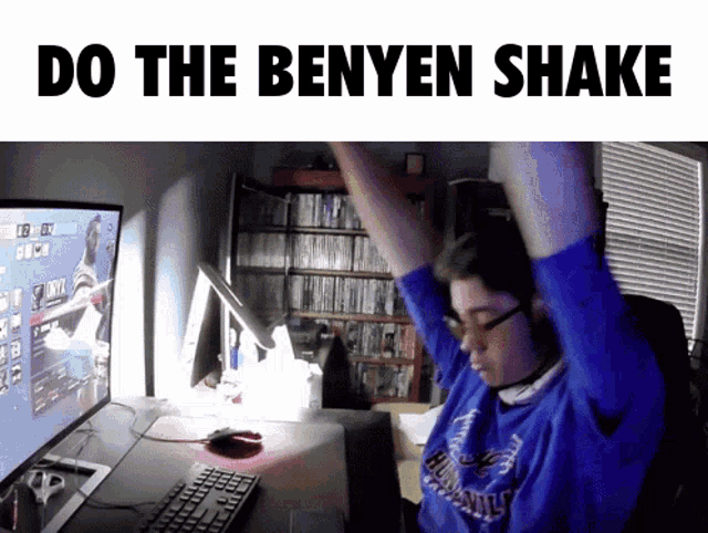 a man playing a video game with the words do the benyen shake