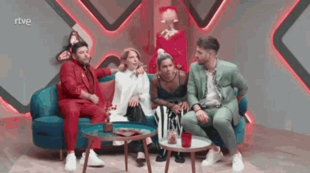 a group of people are sitting on a couch with a rtve logo in the corner