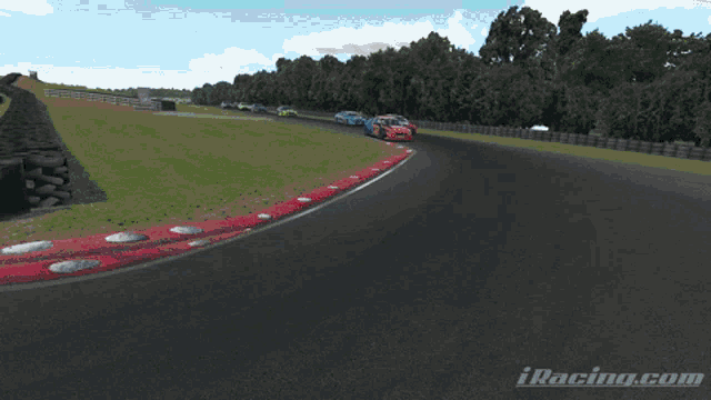 a group of cars are racing on a track and the website iracing.com is visible