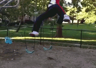 a person is flying through the air on a swing
