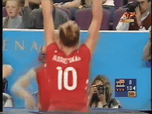 a volleyball player wearing a red jersey with the number 10 on it