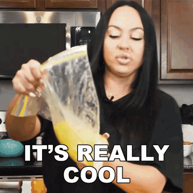 a woman is holding a bag that says it 's really cool on it