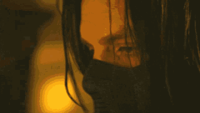 a close up of a person wearing a black mask