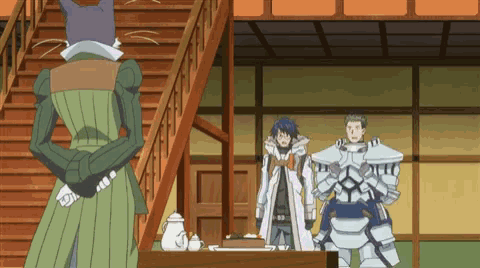 a man in armor is standing next to a woman in a green dress and a cat