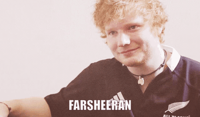 a man wearing a black shirt with the word farsheen on it