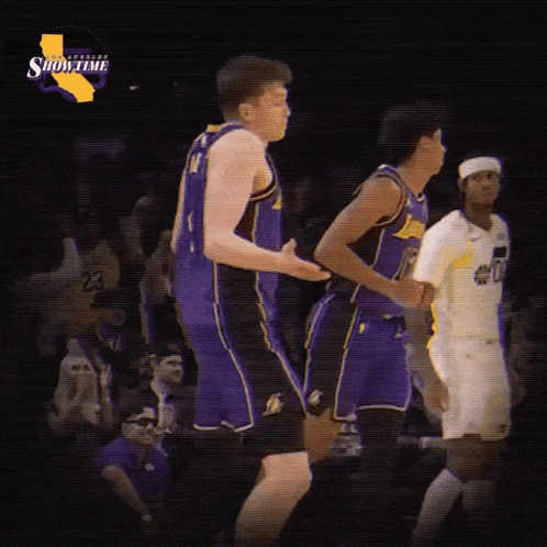 a basketball player wearing a purple lakers jersey with the number 4 on it