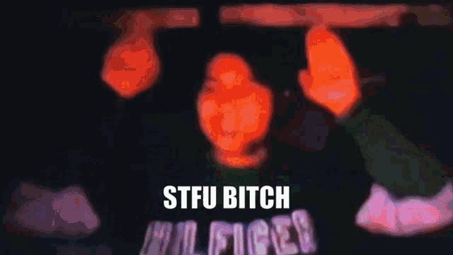 a blurry picture of a person with the words stfu bitch on the bottom right