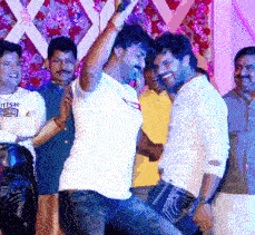 a man in a white shirt with the word tiger on it is dancing