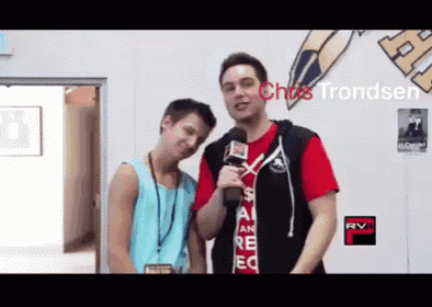 a man holding a microphone next to another man with the name chris trondsen on the bottom right