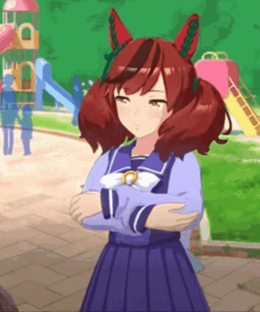 a girl with red hair is standing with her arms crossed in front of a playground ..