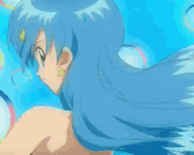 a girl with blue hair is standing next to another girl