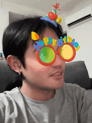 a man wearing glasses that say " happy birthday " on them