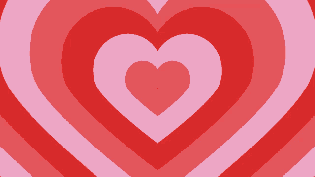 a red and pink heart shaped background with a smaller heart in the middle