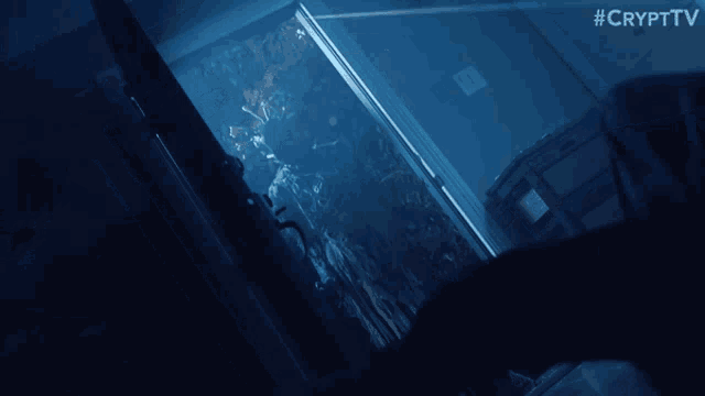 a dark room with a sign that says #crypttv on the bottom