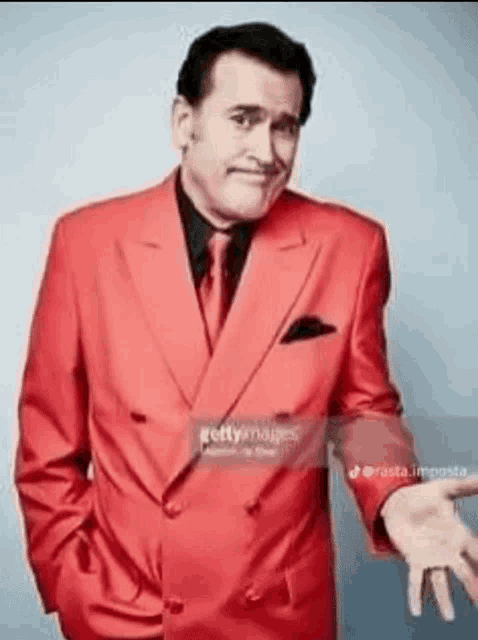 Bruce Campbell Ash Williams GIF - Bruce Campbell Ash Williams Red Suit GIFs